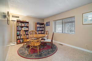 Dining room with a textured ceiling