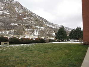 Snowy yard with a mountain view