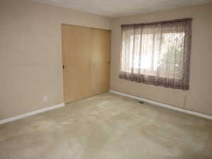 Unfurnished room featuring carpet floors