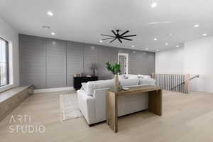 Living room featuring ceiling fan, light hardwood / wood-style flooring, and a healthy amount of sunlight