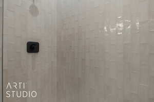 Room details featuring tiled shower