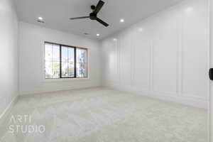 Carpeted spare room with ceiling fan