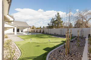 View of yard featuring a patio and a fenced in pool