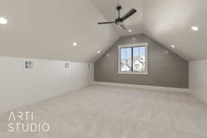 Additional living space featuring ceiling fan, lofted ceiling, and light carpet