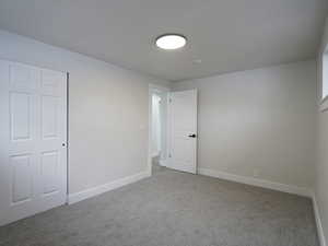 Unfurnished room with carpet floors