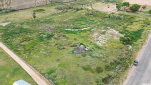 Birds eye view of property featuring a rural view