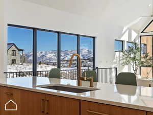 Kitchen with a mountain view and sink