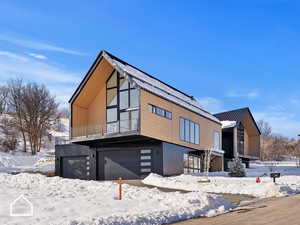 View of front facade featuring a garage