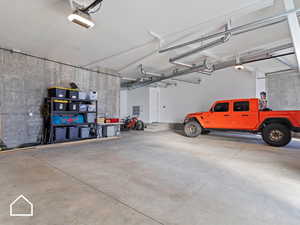 Garage featuring a garage door opener