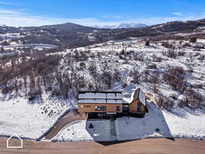 Snowy aerial view with a mountain view