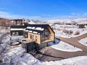 Exterior space featuring a mountain view and a garage