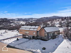 Snowy aerial view with a mountain view