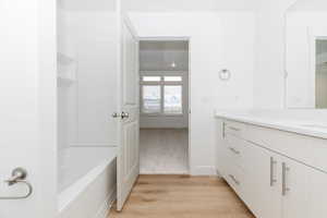 Bathroom with vanity and hardwood / wood-style flooring