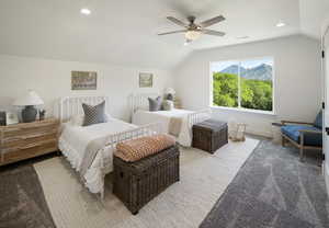 Bedroom featuring carpet flooring, ceiling fan, and lofted ceiling