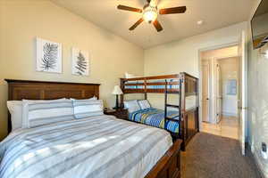 Bedroom featuring ceiling fan and light colored carpet