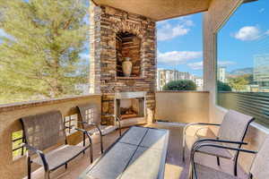 View of patio / terrace with an outdoor stone fireplace