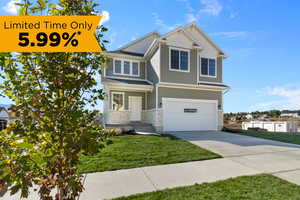 Craftsman house featuring a garage and a front yard