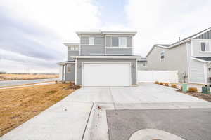 View of front property featuring garage view