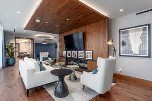 Living room with hardwood / wood-style floors and wood ceiling