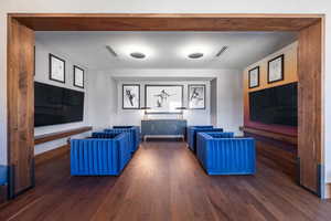 Living room with dark hardwood / wood-style floors