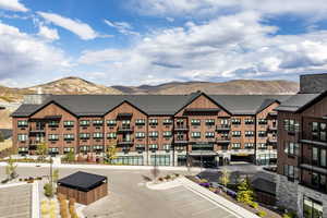 View of property with a mountain view