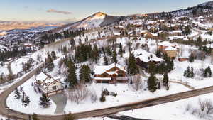 Snowy aerial view featuring a mountain view