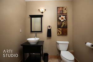 Bathroom featuring vanity and toilet