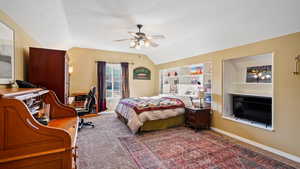 Large upstairs bedroom with ceiling fan and lofted ceiling- flex room/space