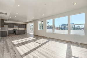 Unfurnished living room featuring light hardwood / wood-style flooring