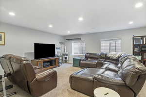 Living room featuring light colored carpet