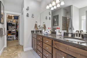 Bathroom with a shower and vanity