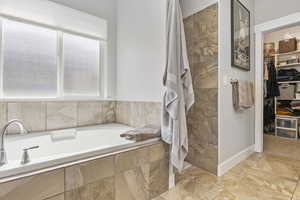 Bathroom featuring plus walk in shower