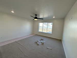 Spare room featuring ceiling fan