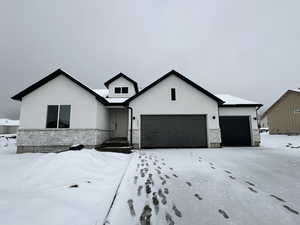 View of front of property with a garage