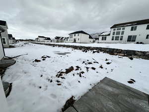 View of yard layered in snow