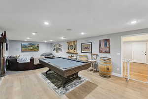 Rec room with light hardwood / wood-style floors and pool table