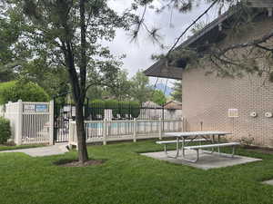 Exterior space featuring a lawn and a swimming pool