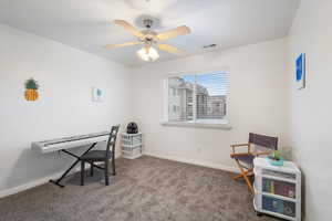 Sitting room featuring carpet floors and ceiling fan