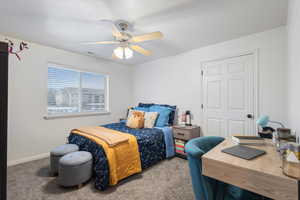 Carpeted bedroom with ceiling fan