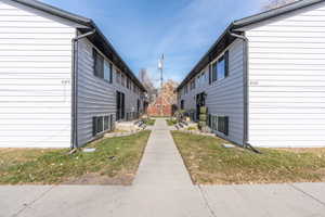 View of property exterior with a yard