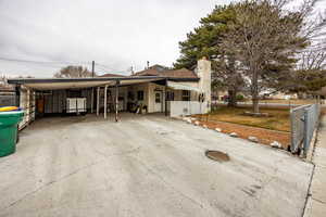 View of front of property featuring a carport