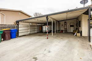 Garage featuring a carport