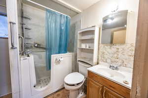 Bathroom featuring vanity and toilet