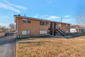 Exterior space featuring a front lawn