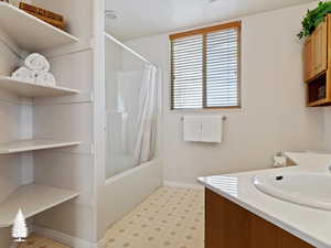 Bathroom with vanity and shower / bath combo