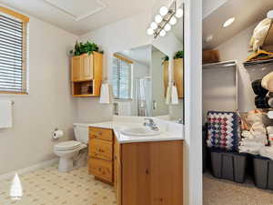 Bathroom featuring vanity and toilet