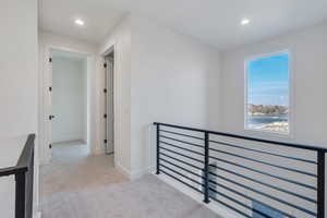 Hallway with light carpet