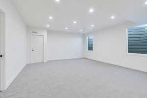 Spare room featuring light colored carpet