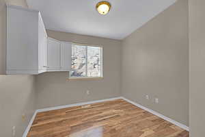 Spare room with light wood-type flooring