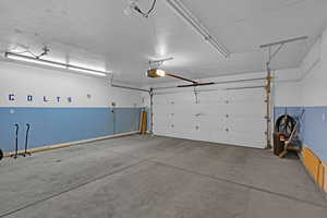 Garage featuring a garage door opener